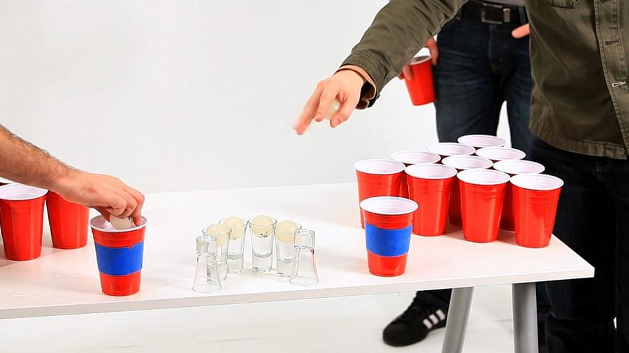 Players demonstrating popular beer pong shooting techniques