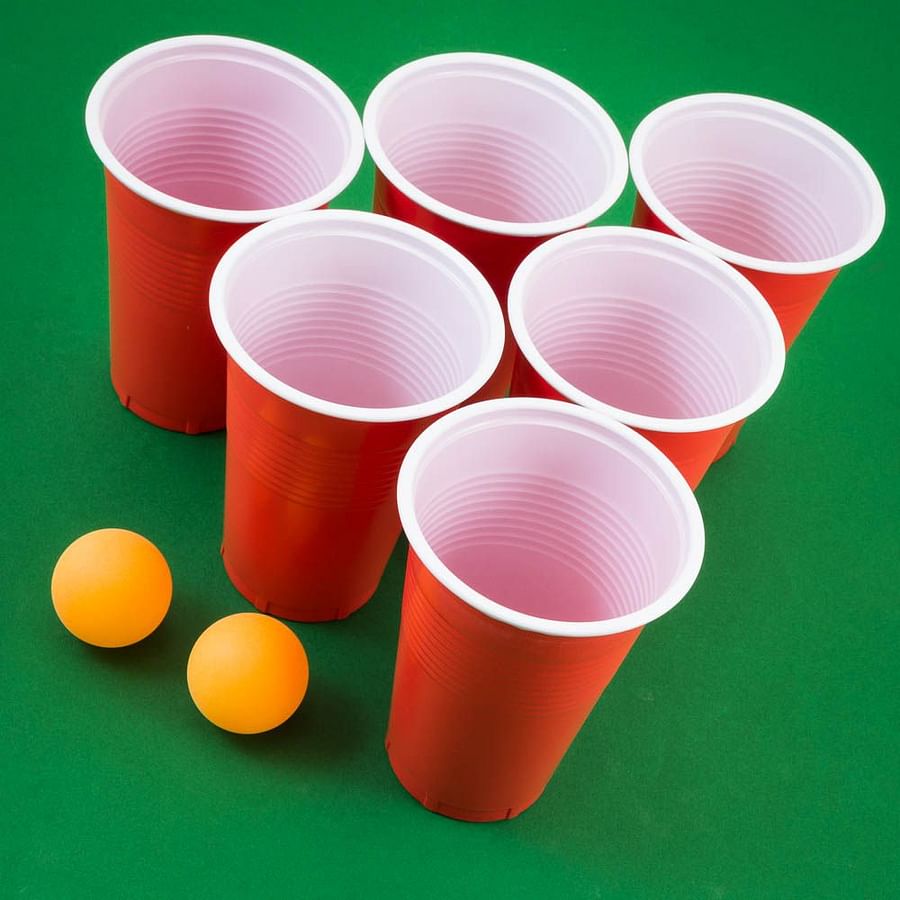 Two players engaged in a tense game of Beer Pong